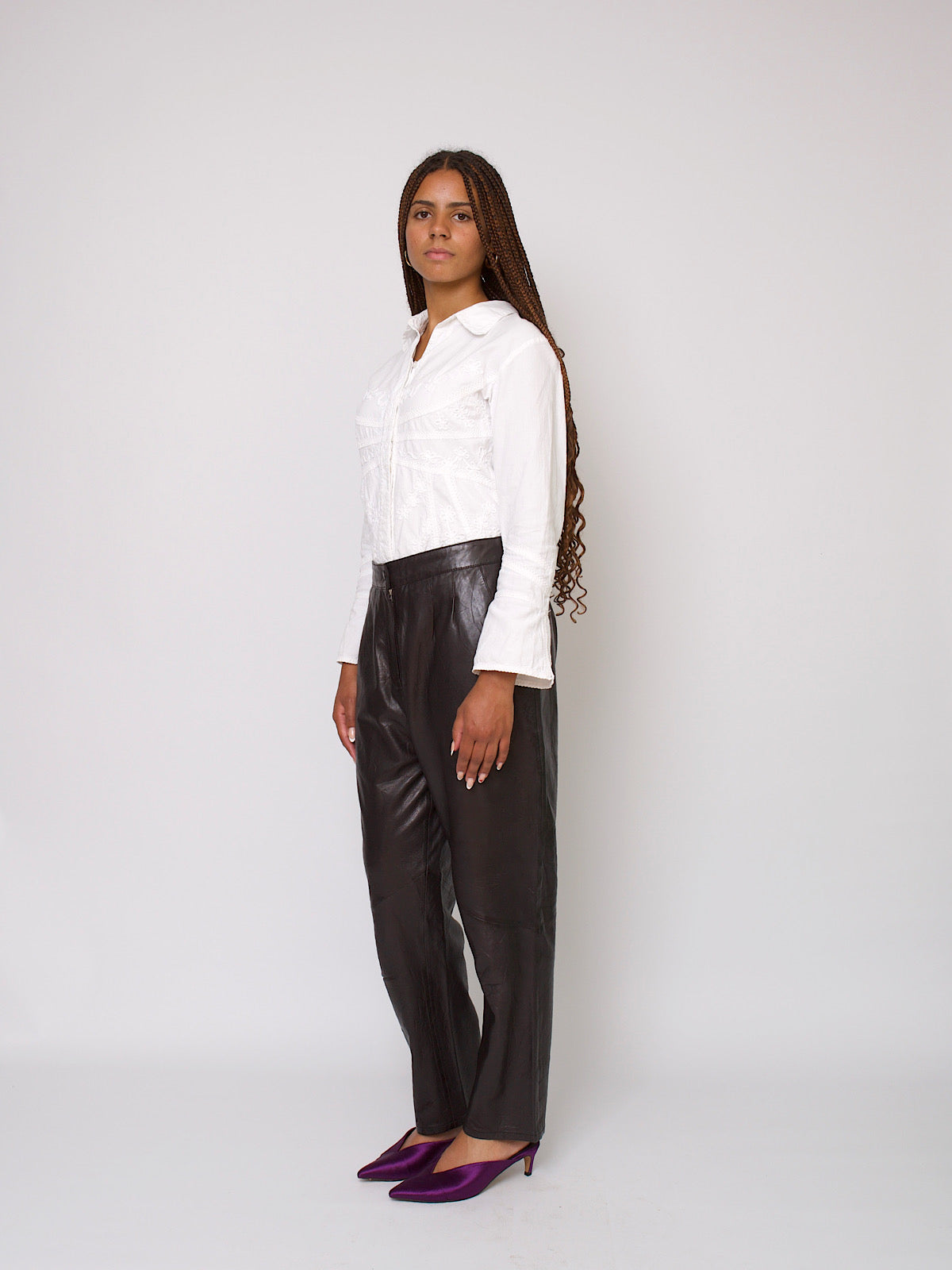 80s vintage high waisted pleated leather trousers in black