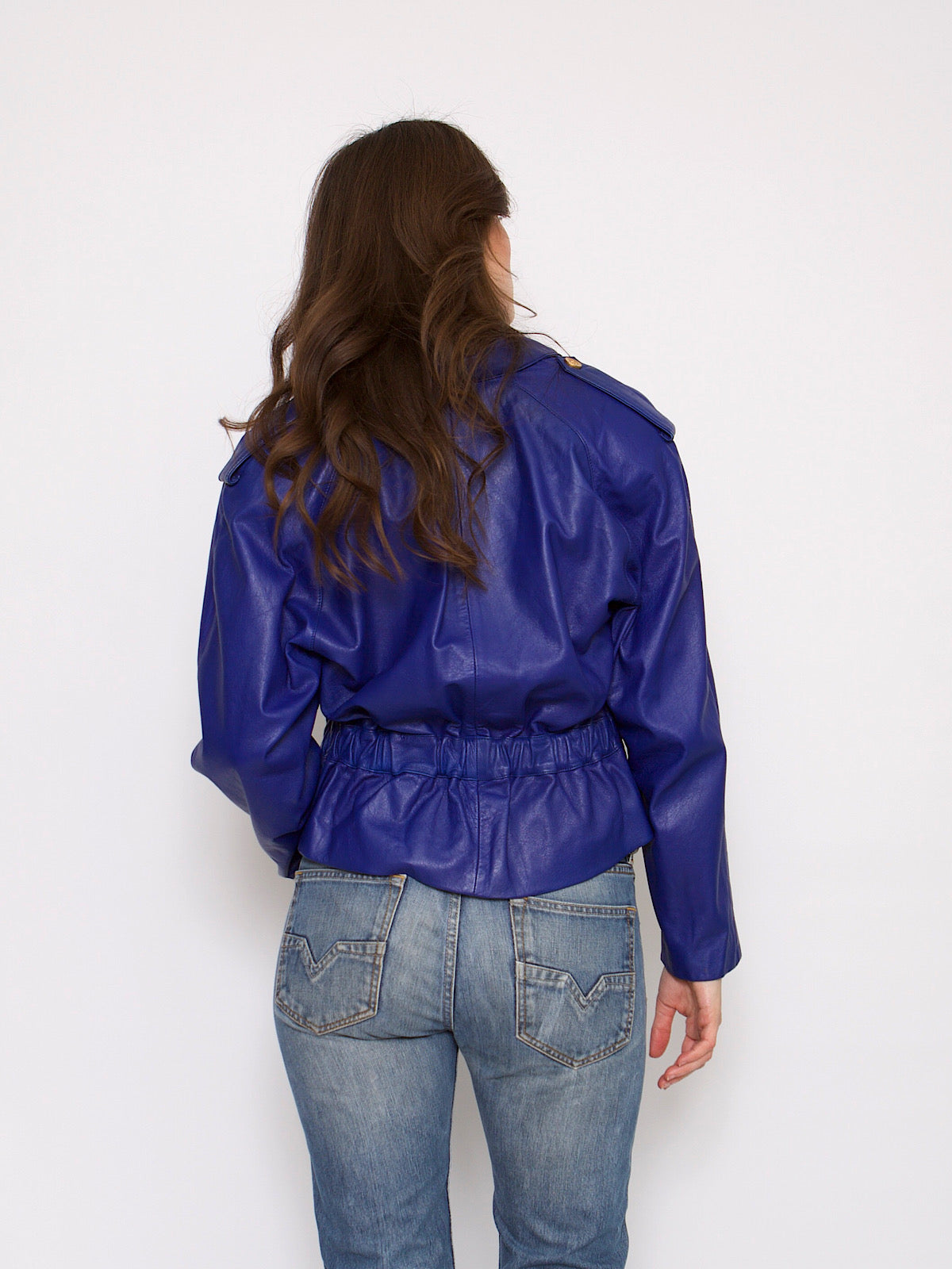 80s vintage blue leather jacket fitted at the waist